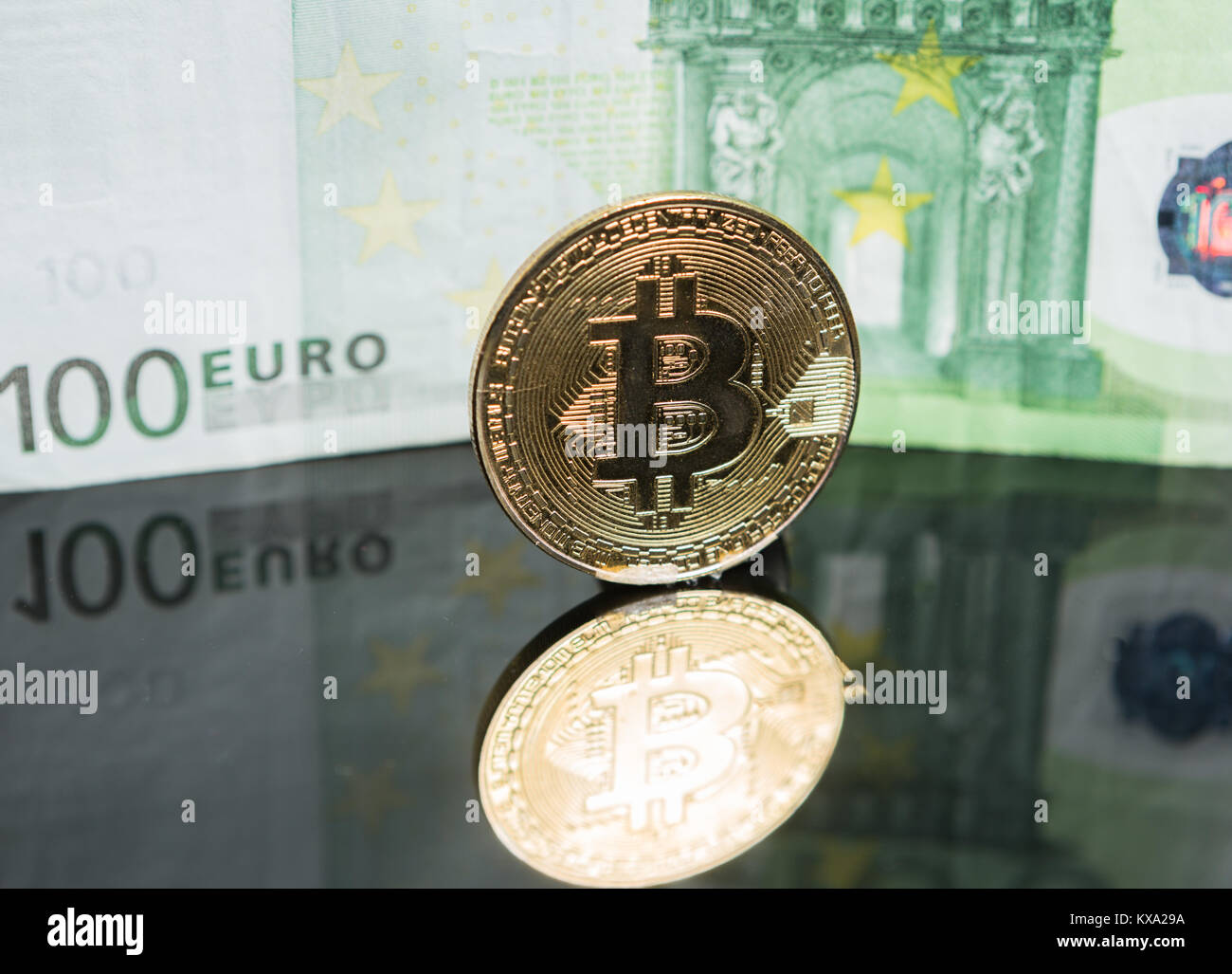 Golden and silver bitcoin on hundred dollars abstract background. Crypto-currency  Stock Photo - Alamy