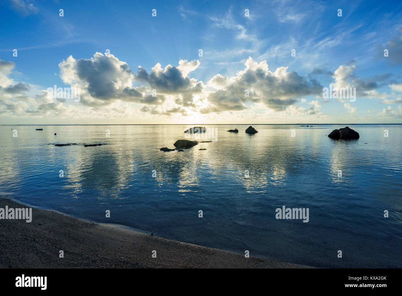 clouds reflections and granite rocks in the water, sunrise on