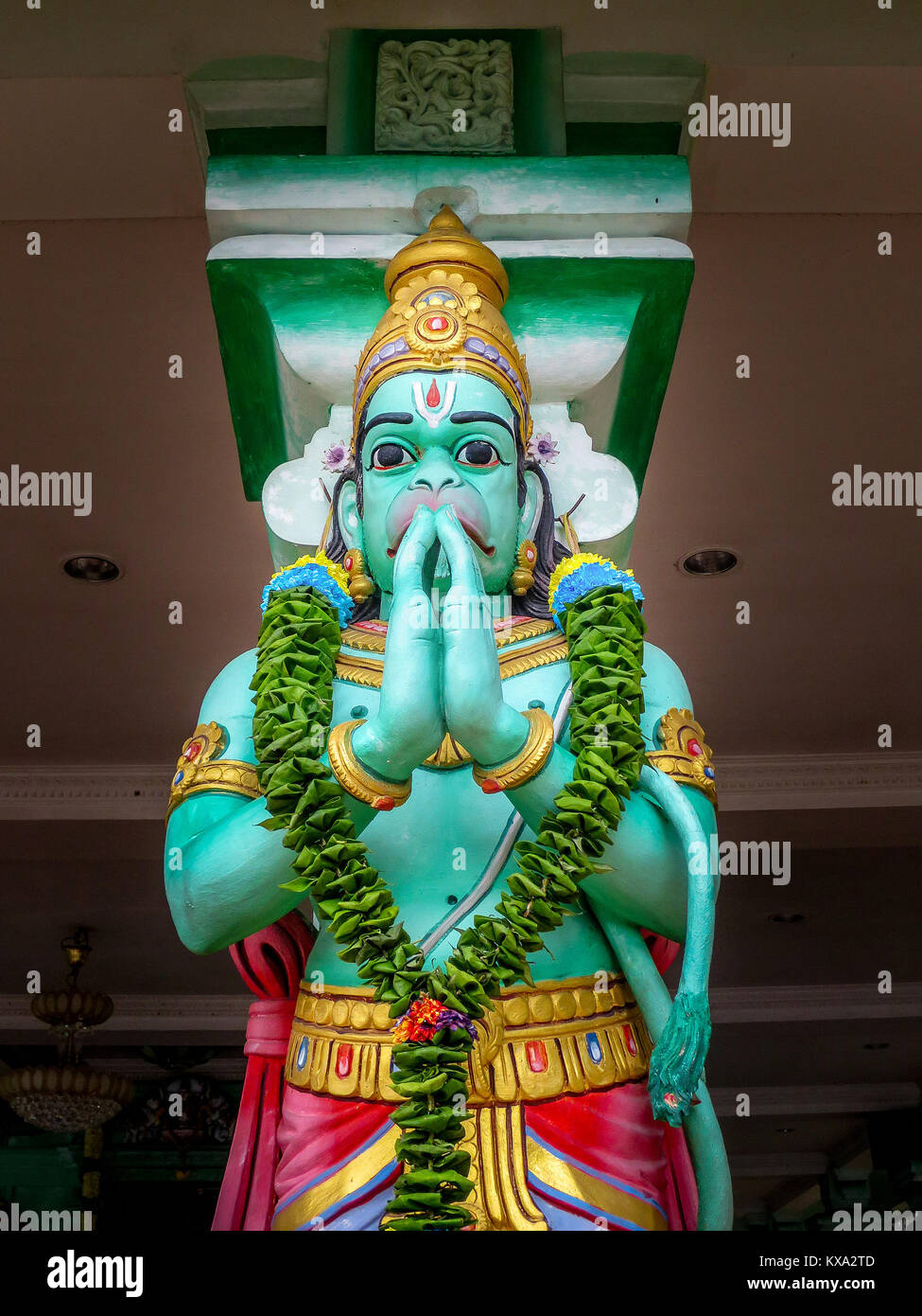 One of many statues to Hanuman, a popular Hinduism deity, that stand in the popular tourist attraction , Batu Caves at Gombak, Selangor, Malaysia. Stock Photo