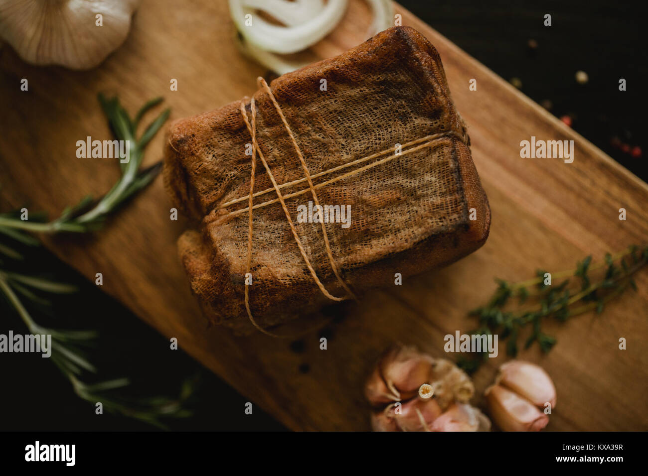 Chunk of salted smoked lard in gauze with a rope.Traditional Russian