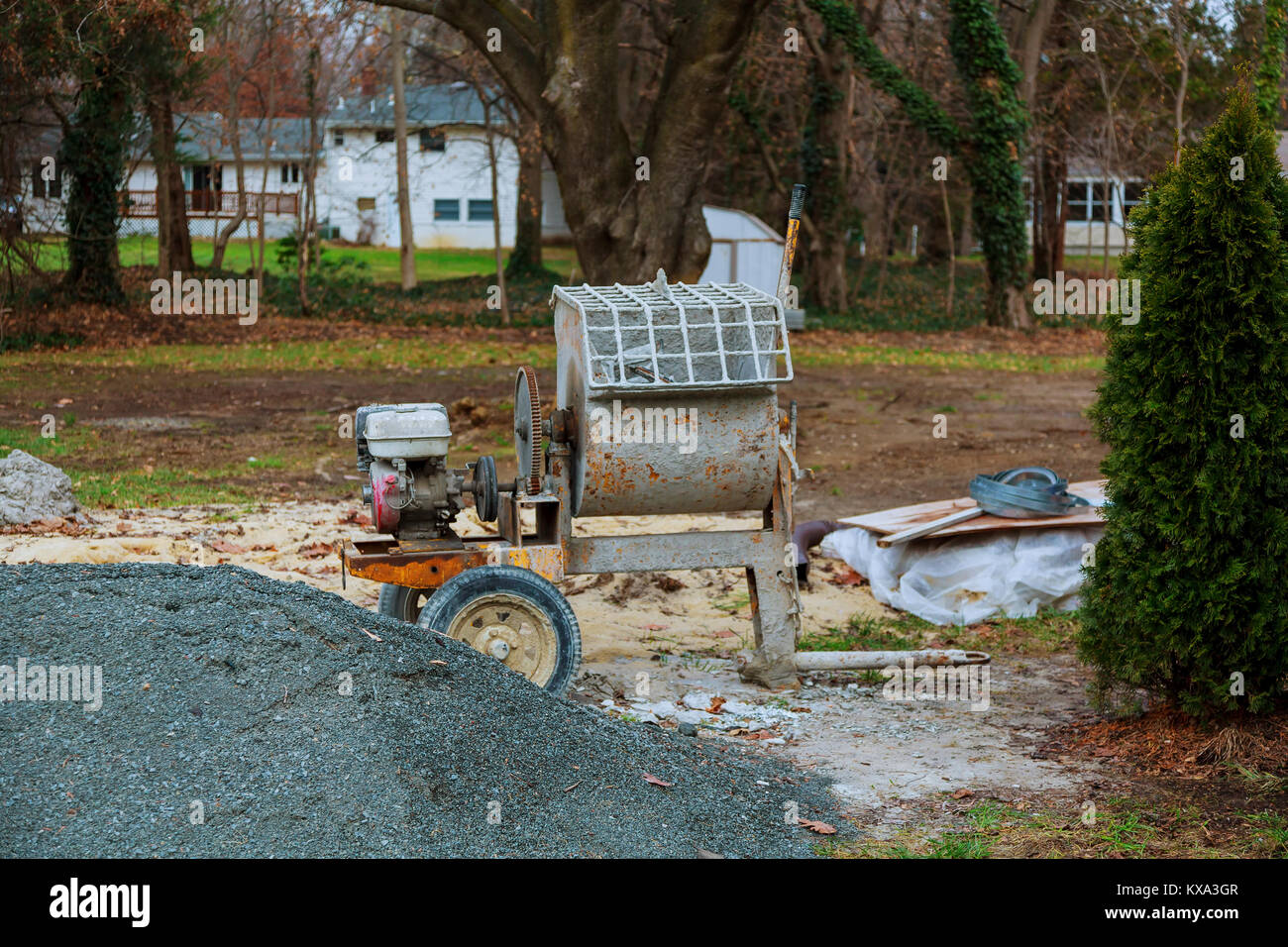 Concretemixer is left after working time at construction site, concrete mixer for mixing