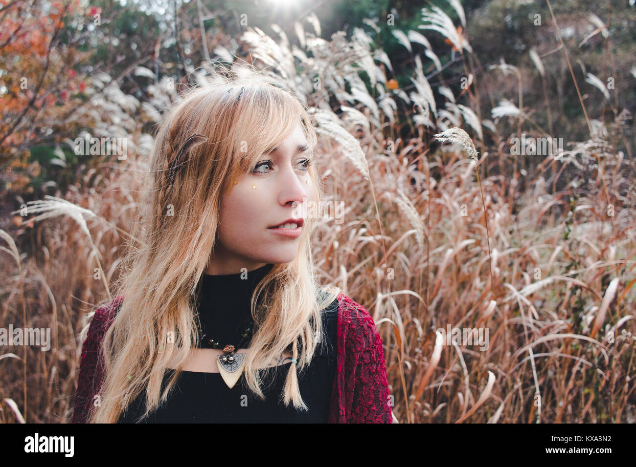 Young woman looking in the distance. Taken at Columcille megalith park, Pennsylvania Stock Photo