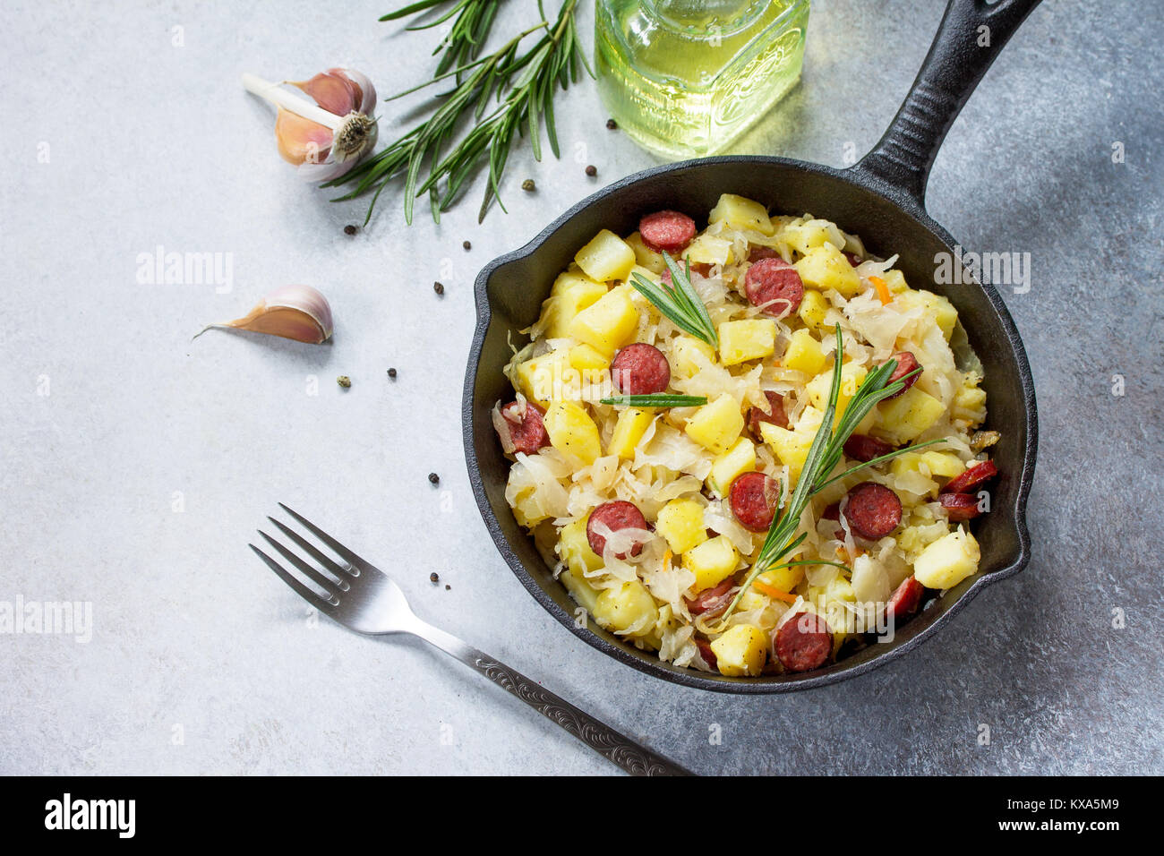 Warm salad with potatoes sauerkraut and smoked sausages Stock Photo Alamy
