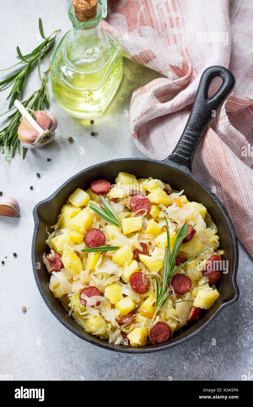 Warm salad with potatoes sauerkraut and smoked sausages Stock Photo Alamy