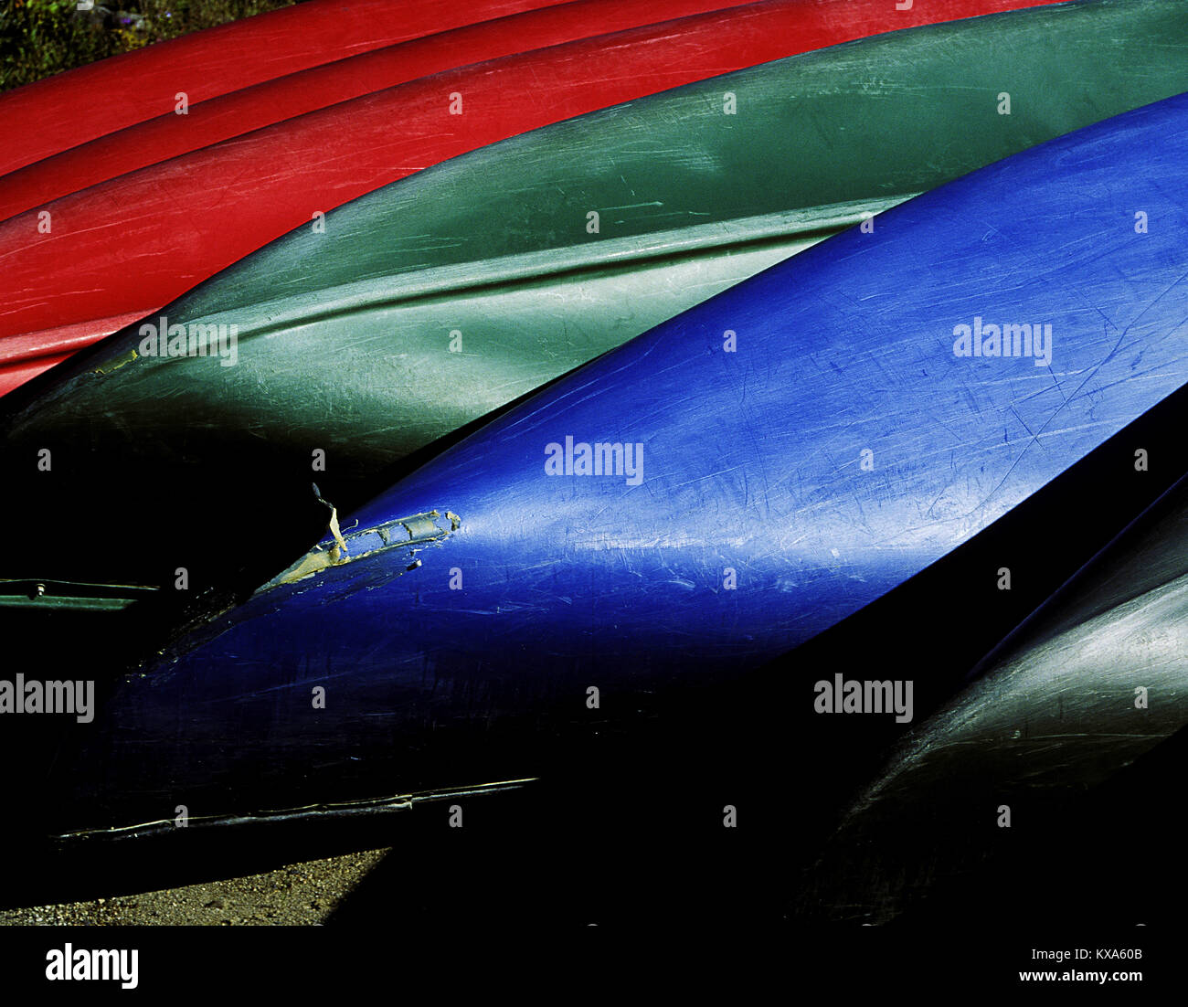 Detail of Canoes upside down on shore. Stock Photo