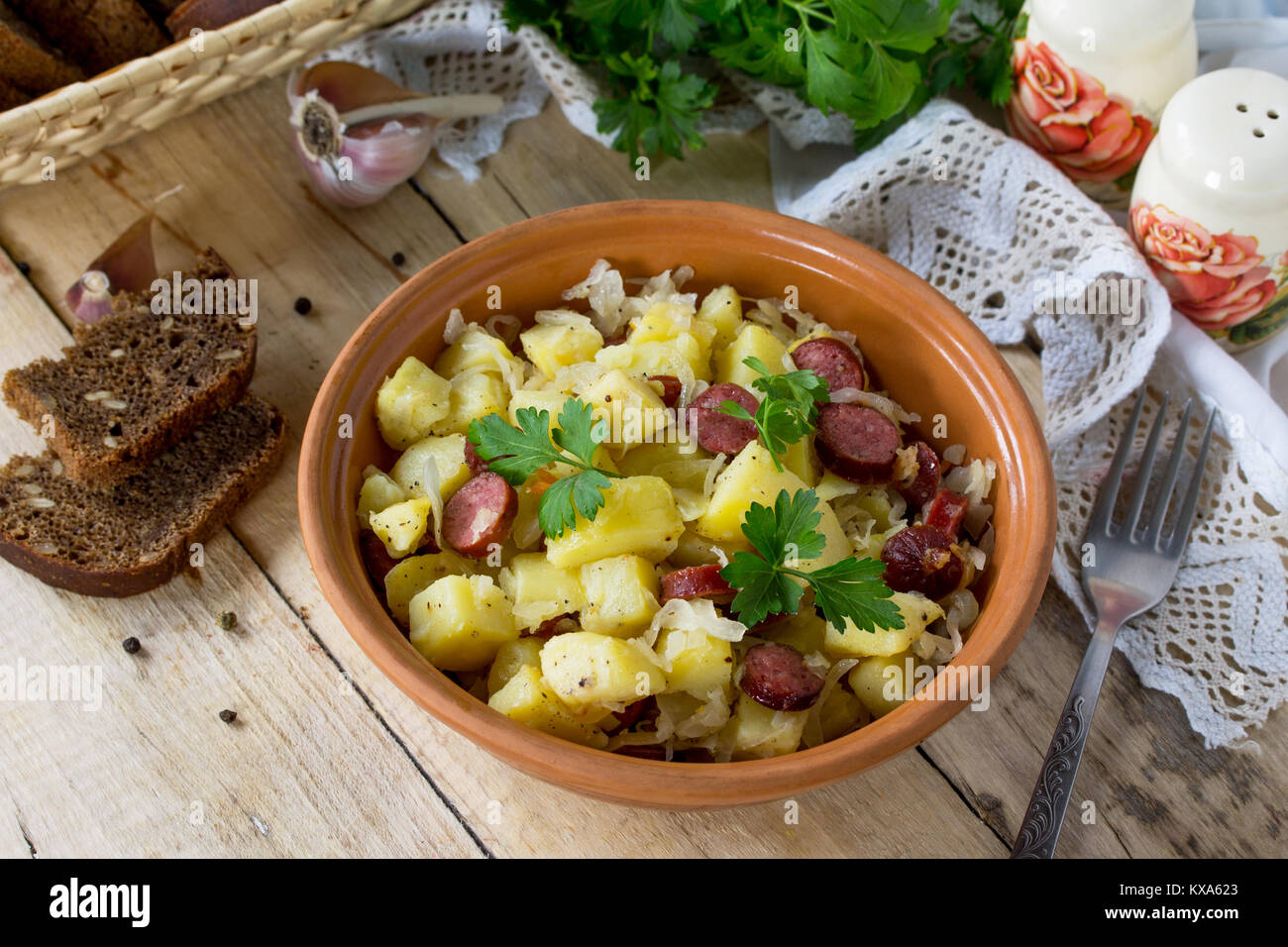 Warm salad with potatoes sauerkraut and smoked sausages Stock Photo Alamy