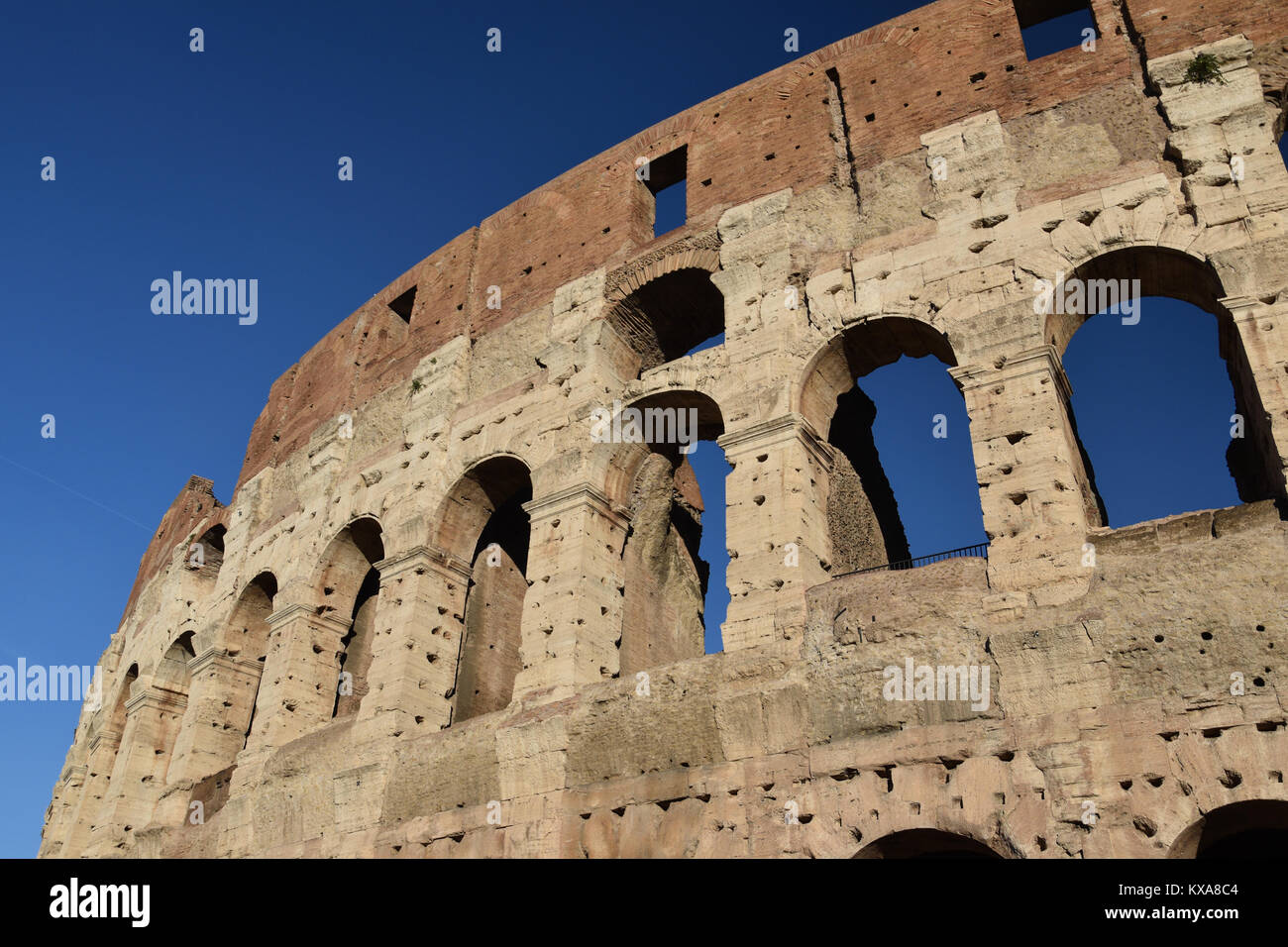 November 28th, 2017; The Colosseum, Rome, Italy. Exterior of the Colosseum against a bright blue sky. Stock Photo