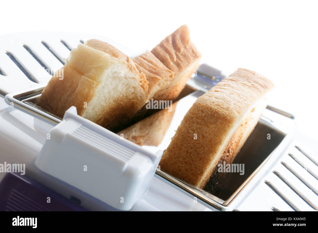 Toast in a toaster. Fried toast slices inside the toaster. A closeup