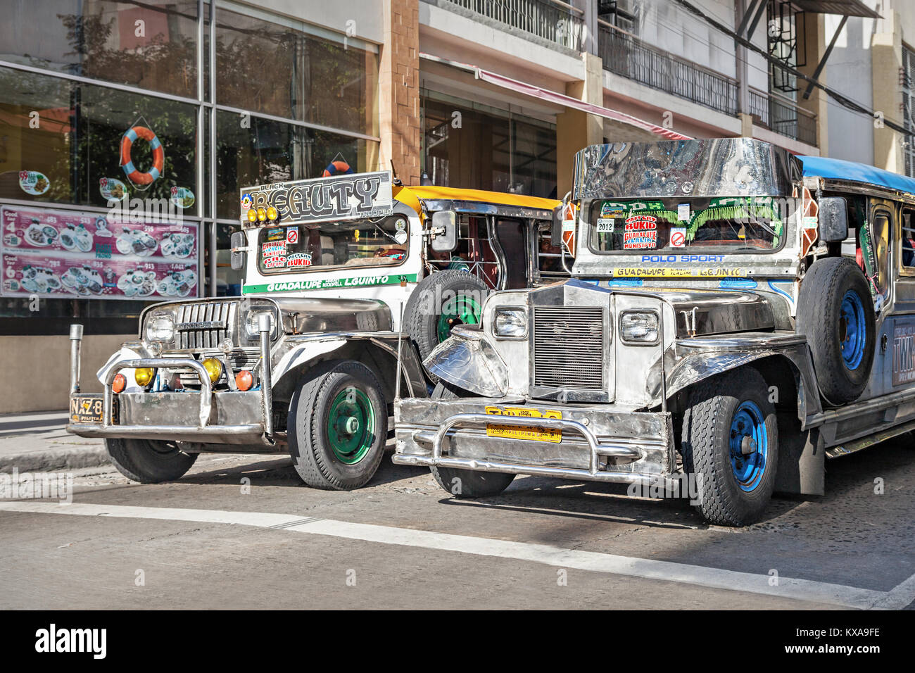 MANILA, PHILIPPINES - FEBRUARY 24: Jeepney on the street on February, 24, 2013, Manila, Philippines. Jeepneys are the most popular means of public tra Stock Photo