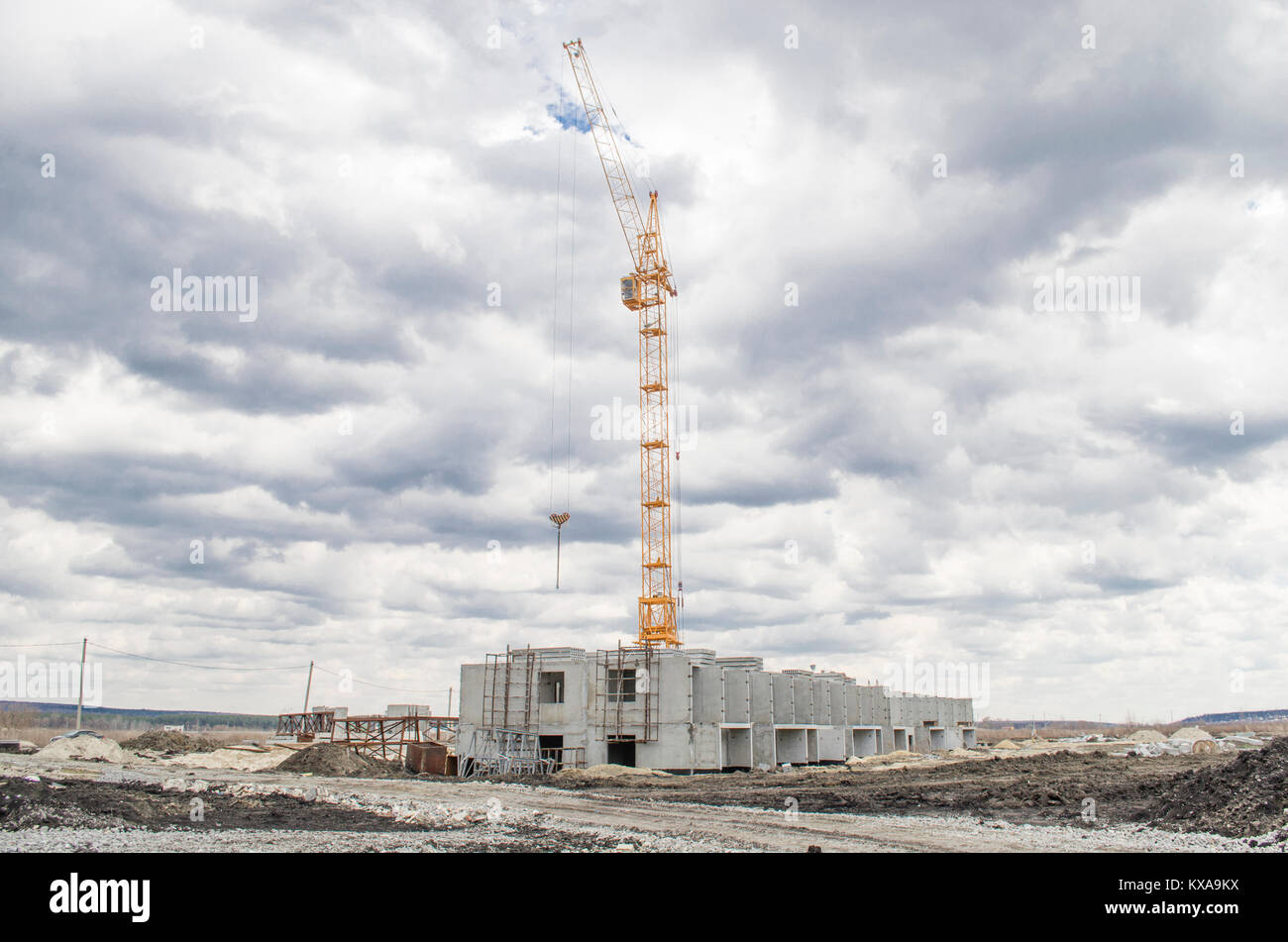 Lift crane building a new residential building Stock Photo