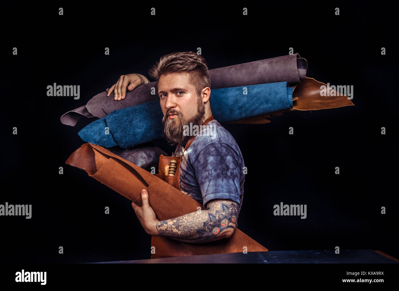 Leather cutter at work in his place of work Stock Photo Alamy