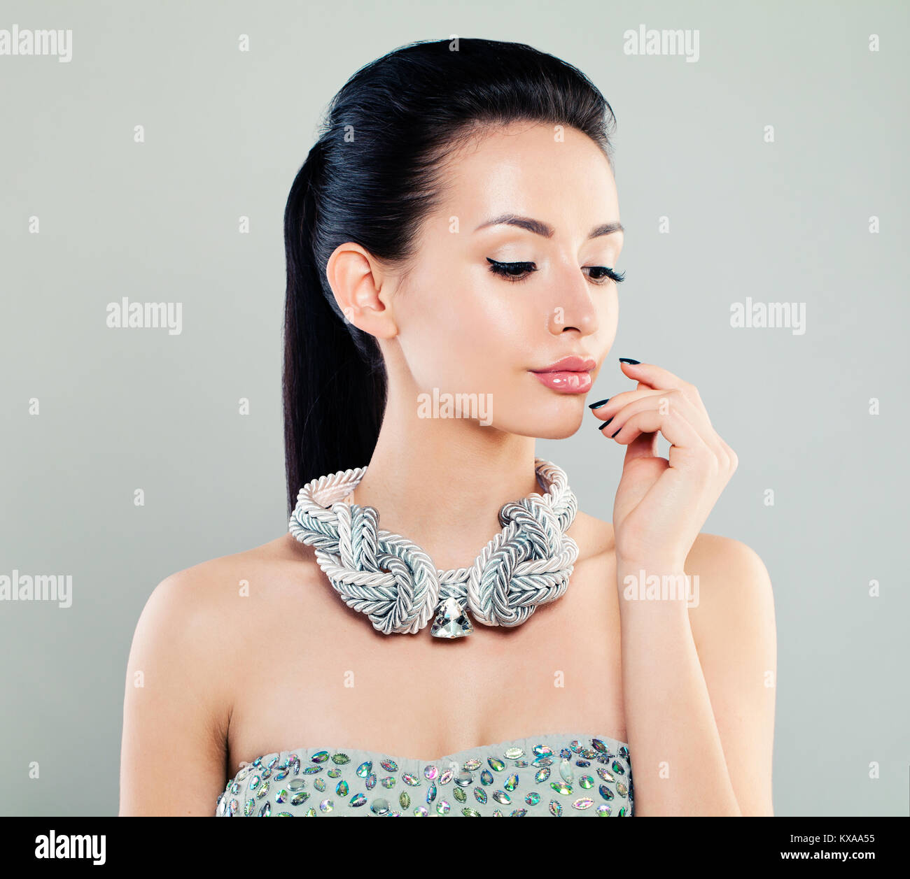 Fashion Portrait of Beautiful Woman Model in Silver Cloth Stock Photo