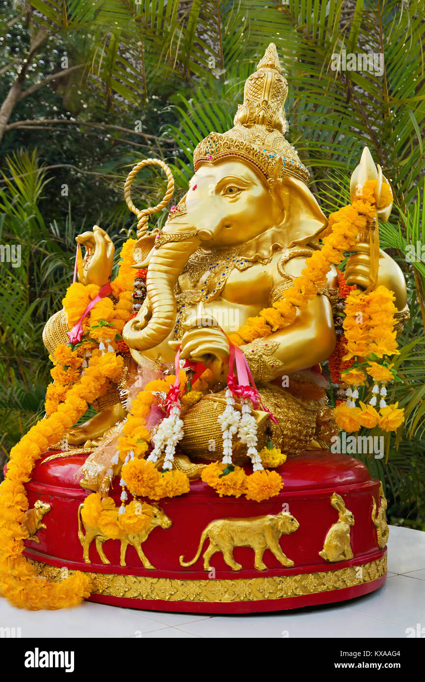 Lord Ganesha statue decorated with flowers Stock Photo Alamy