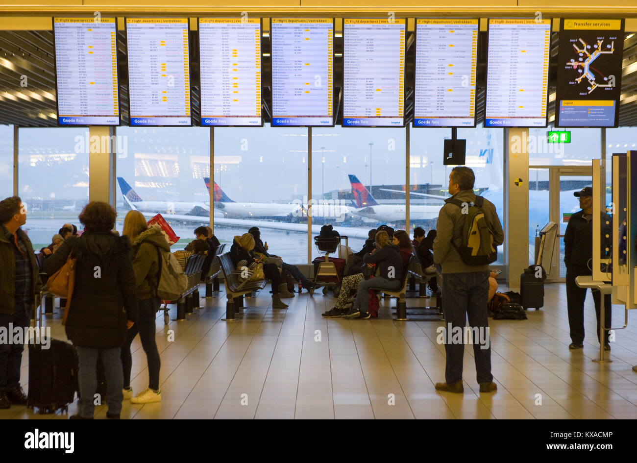 AMSTERDAM, NETHERLANDS - DEC 27, 2017: People are waiting at their gate for their flight on Schiphol airport near Amsterdam Stock Photo