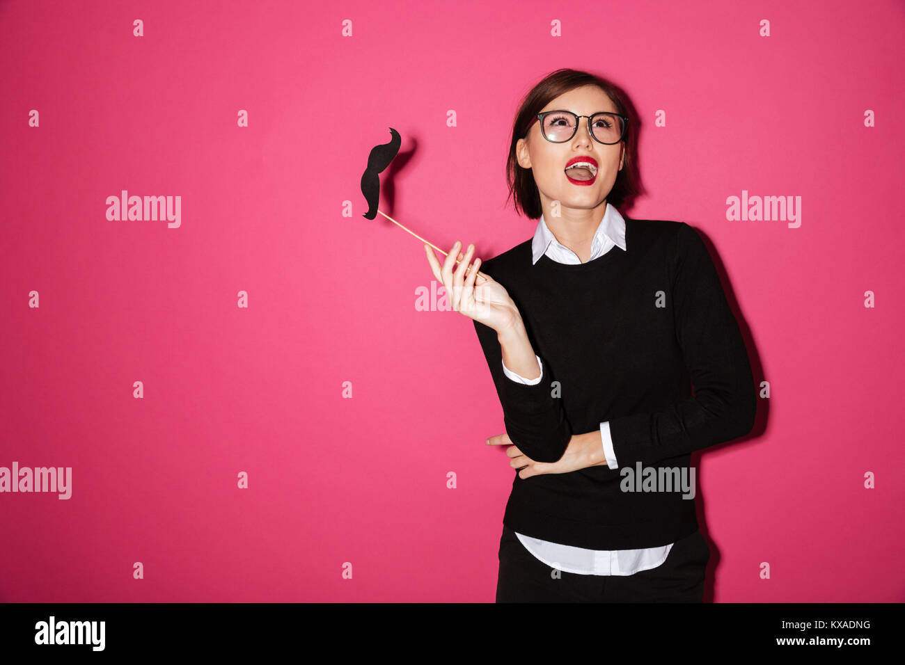 Woman wearing fake moustache hi-res stock photography and images - Alamy