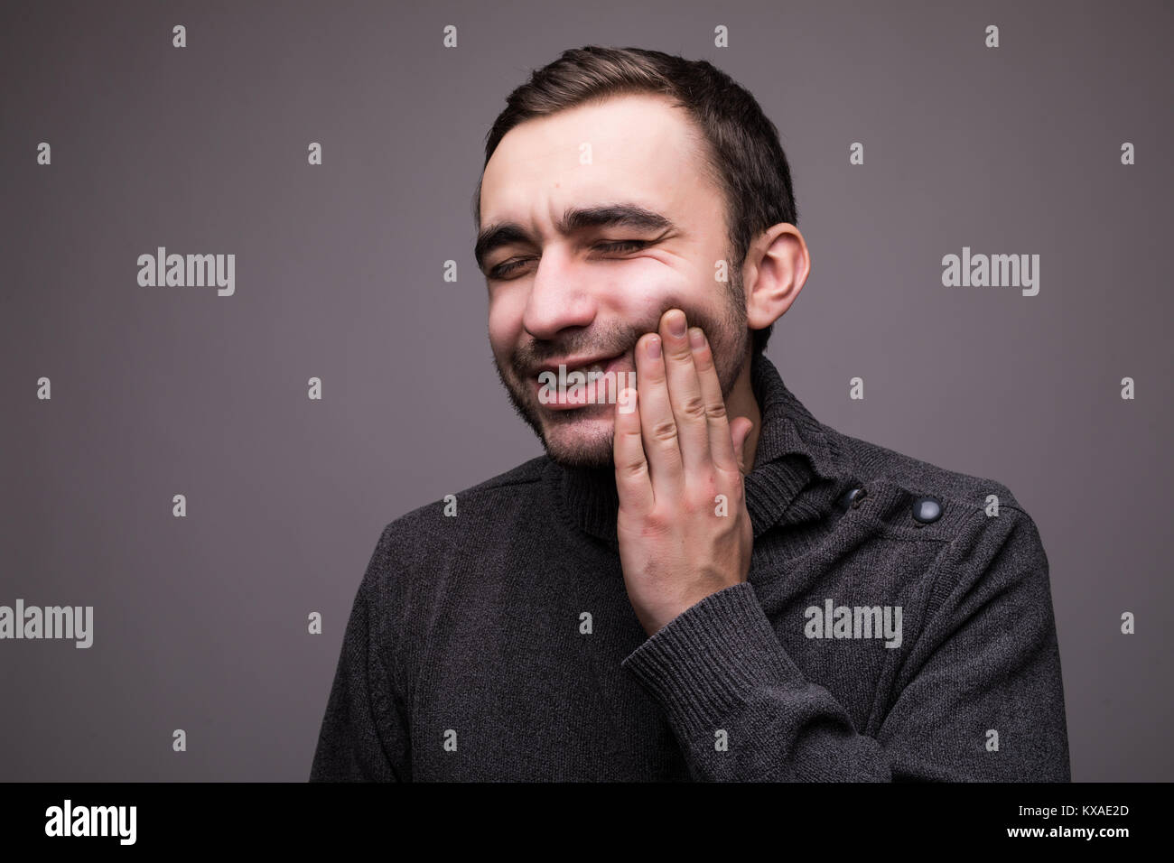 Closeup portrait of young man with tooth ache crown problem about to