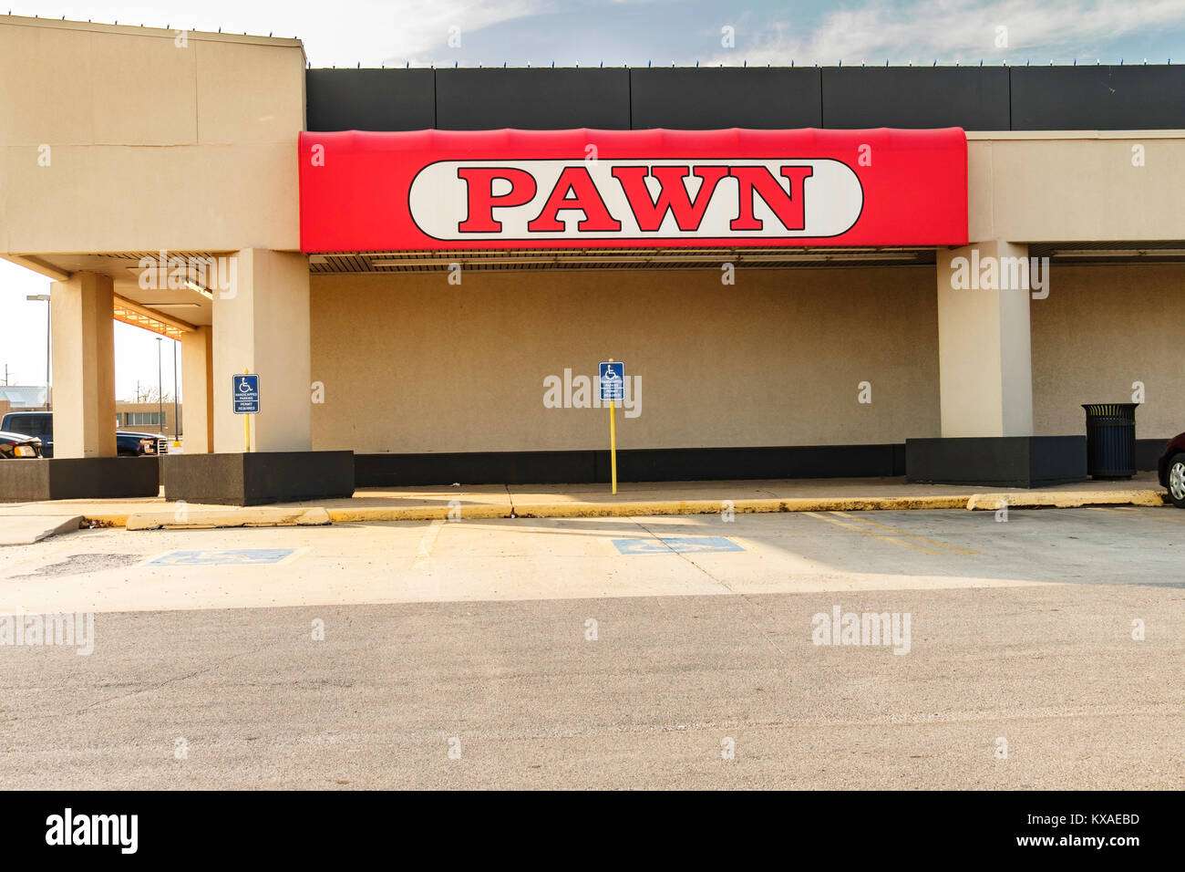 The side of a pawn shop and sign with handicapped parking in a shopping center in Oklahoma City, Oklahoma, USA. Stock Photo