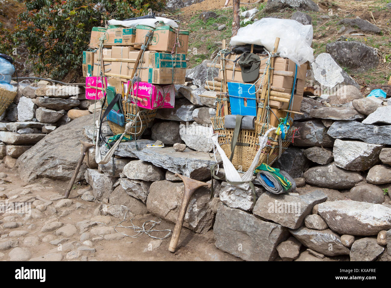 Two improvised backpacks of Nepalese porters, seen halfway the hike to Everest Base Camp in the Khumbu valley. Stock Photo