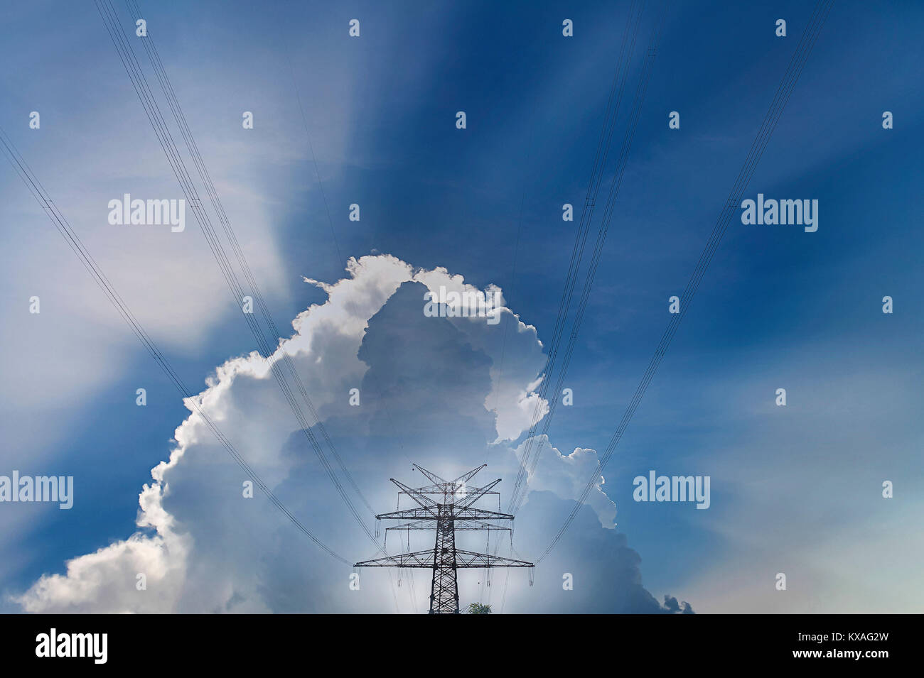 Power line,high-voltage line,overhead line in front of cloud,Germany Stock Photo