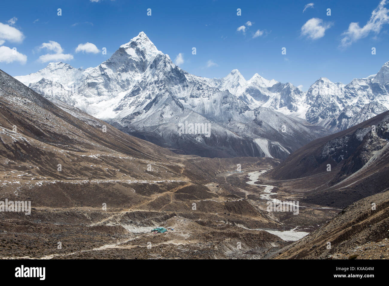 Helicopter view over the upper Khumbu valley with the village of Pheriche and the mountain Thamserku. Stock Photo