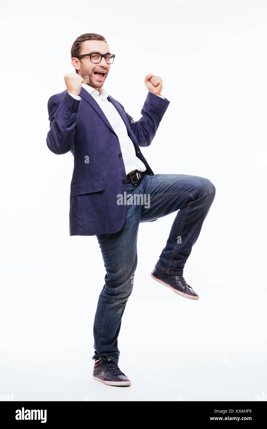 Excited elated happy young business man with beard in classic suit ...
