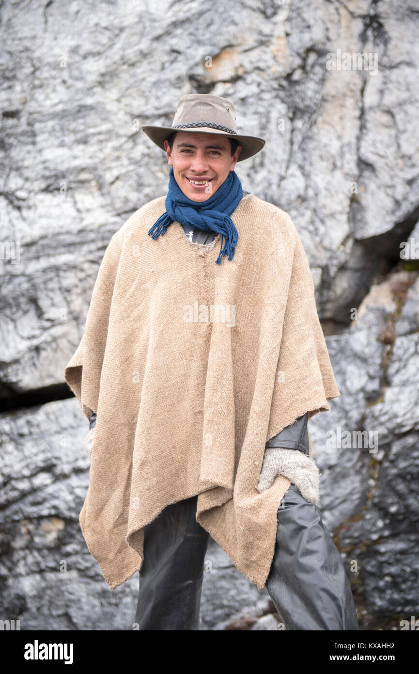 Portrait of porter wearing poncho and smiling at Sierra Nevada del Cocuy, Boyaca, Colombia Stock Photo