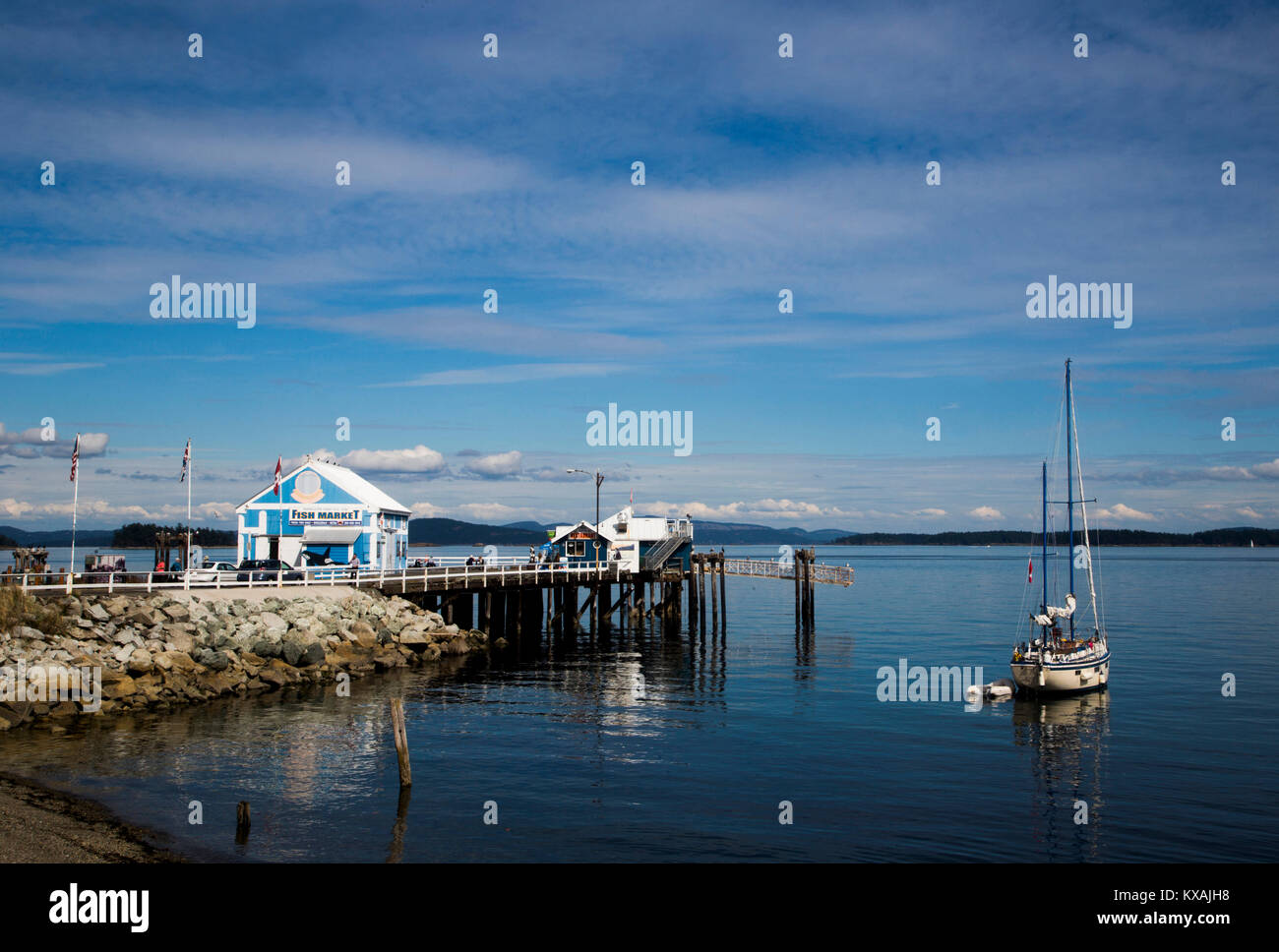 Sailboat near pier off coast of Galiano Island, Gulf Islands, British Columbia, Canada Stock Photo