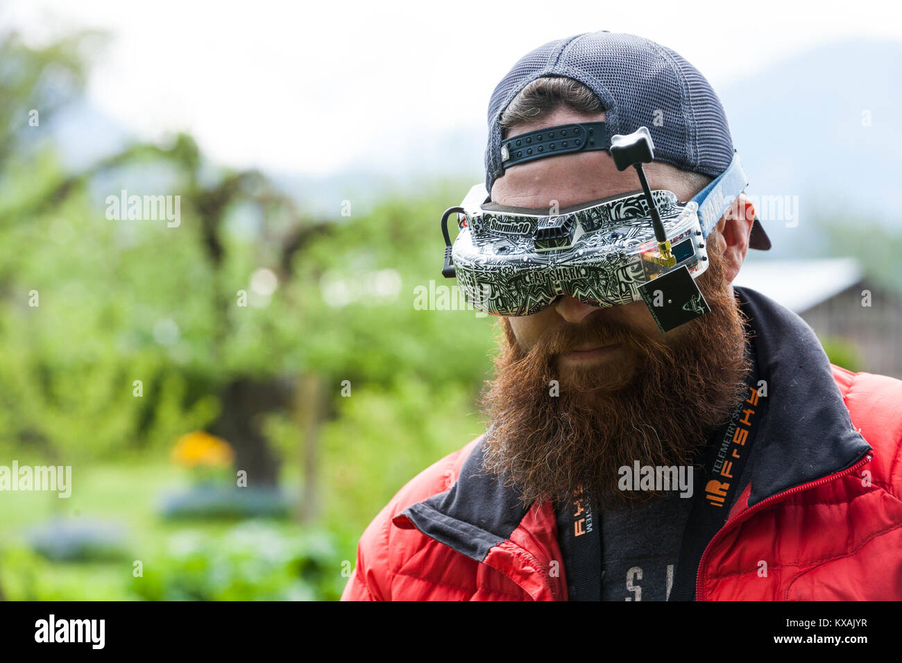Drone racing pilot wearing virtual reality goggles, Chilliwack, British Columbia, Canada Stock Photo