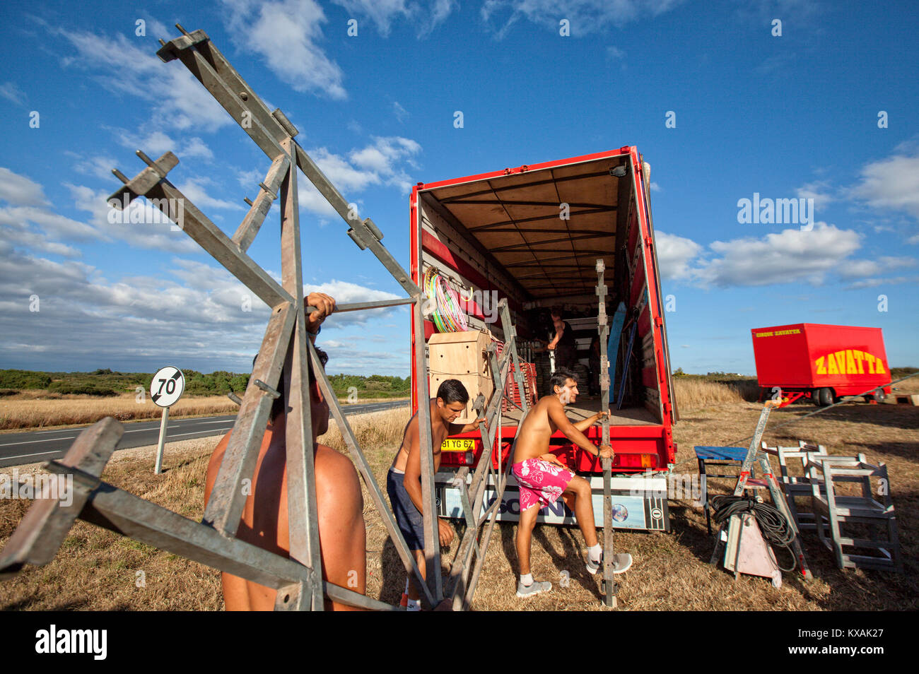 Members of Zavatta family loading truck with parts of circus ring stage, Zavatta Circus, Kerroch, Morbihan, Brittany, France Stock Photo