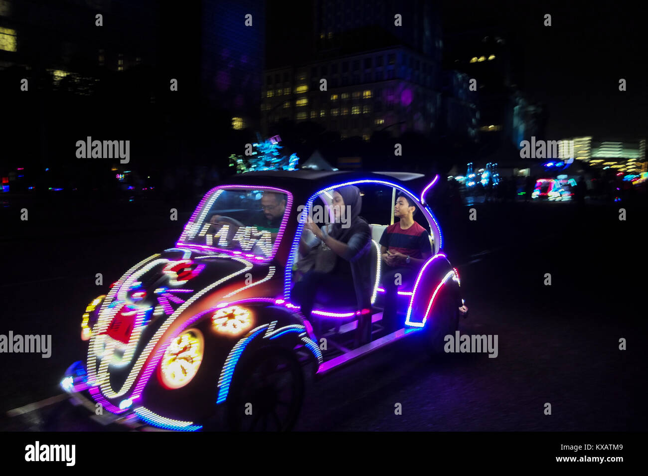 KUALA LUMPUR, MALAYSIA - DECEMBER 28: People plays a car light made from L.E.D during the Putrajaya Lighting Festival on December 28, 2017 in Putrajaya, Malaysia. The four-night festival featured a light art communities and university students in Malaysia showcasing their creativity of light-themed events, including Luminous lighting effect show, decorative arch and light structure exhibits, car light show, night fun ride, wayang kulit performance (shadow puppetry), and a light garden . Credit: Samsul Said/AFLO/Alamy Live News Stock Photo