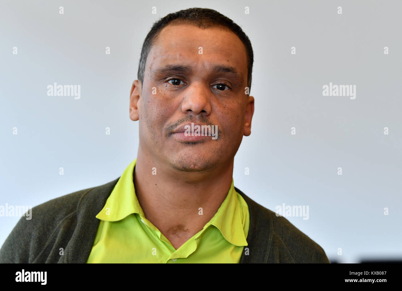 The doctor Marco Leitzke of the initiative Schwarze Menschen in  Deutschland e.V. (lit. black people in Germany) stands in front of a wall  in the Thuringian parliament in Erfurt, Germany, 09 January