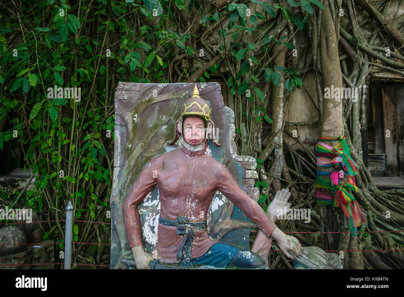 Tourist posing in peep board mock warrier scenes in Bang Kung Camp, Samut Songkhram, Thailand. Stock Photo