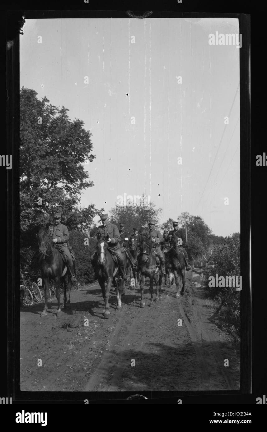 This image shows higher-ranking officers on horseback, likely from a ...
