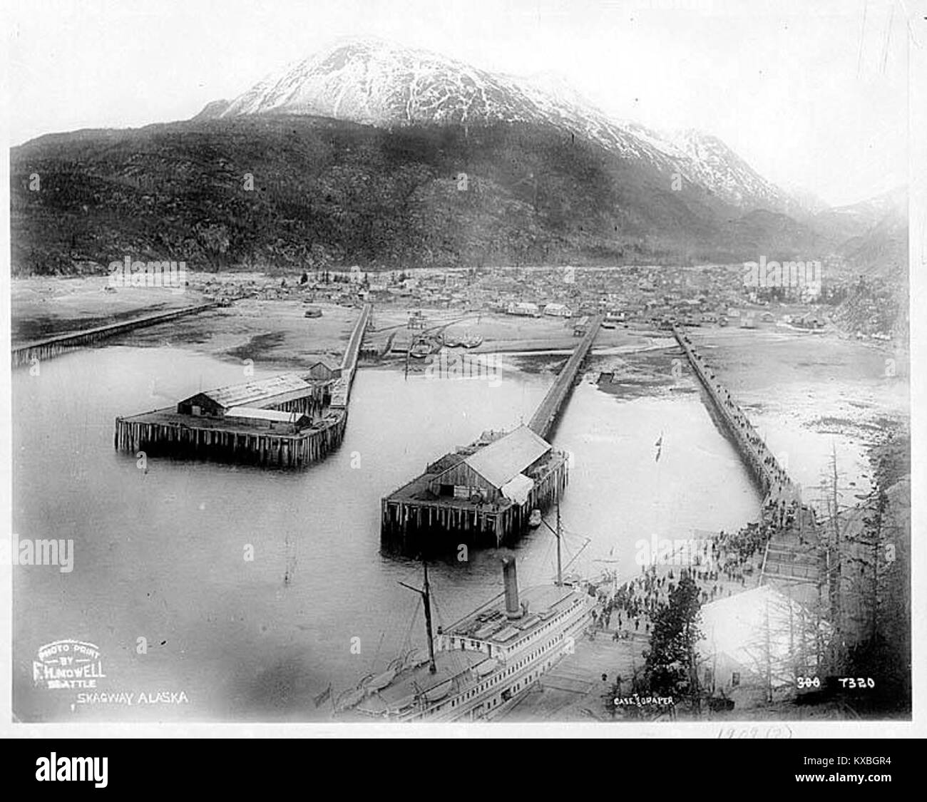 Skagway, showing wharves and steamship unloading passengers in