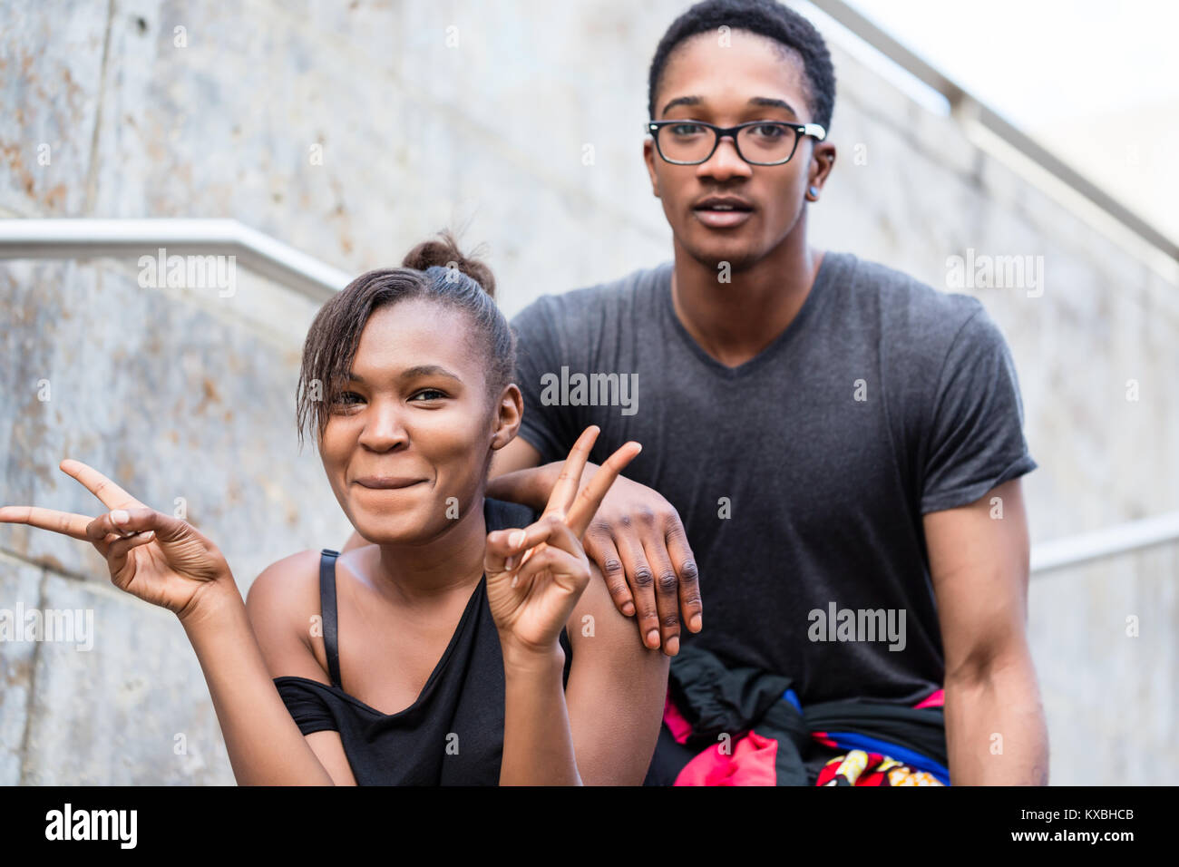 Portrait of young African American couple making funny faces whi Stock ...