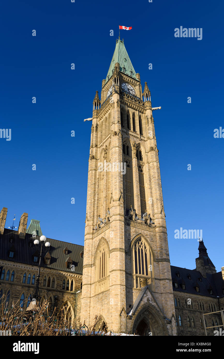 Peace tower with Canadian flag of the Parliament Buildings in Centre Block confederation Hall on Parliament Hill Ottawa Canada in winter Stock Photo