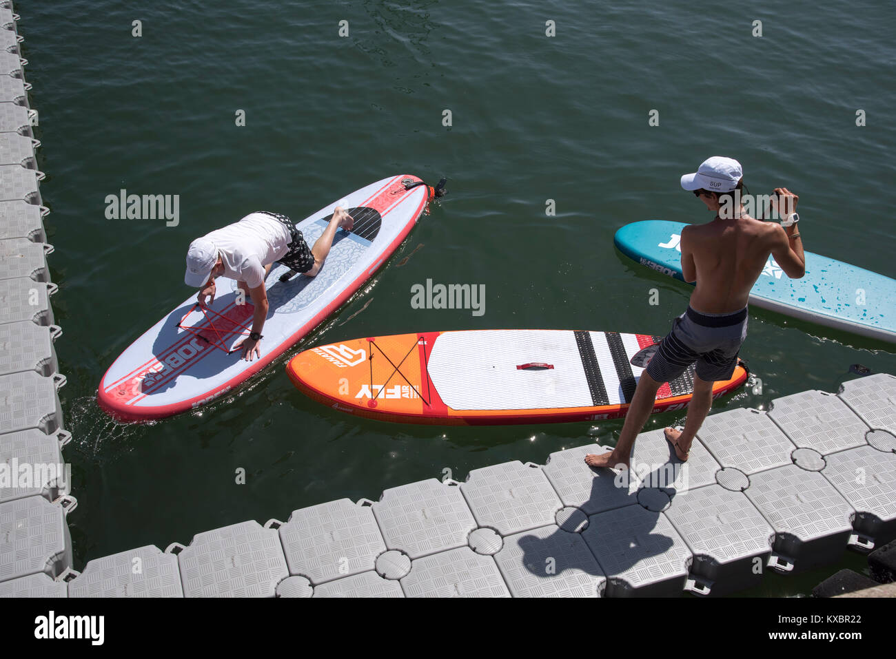 Cape Town harbour South Africa. December 2017. Paddle boarder working