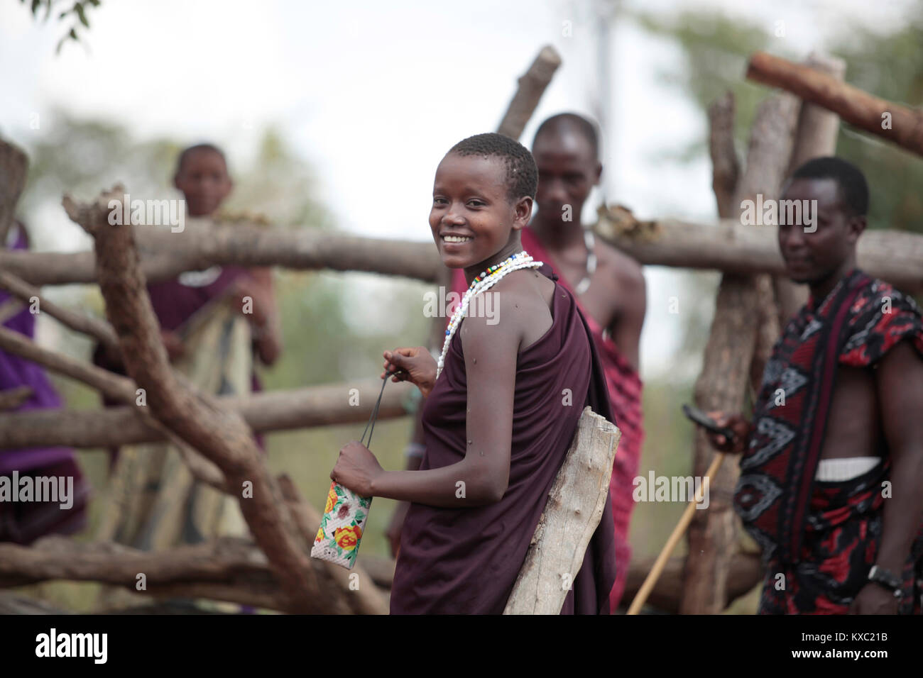 A Maasai woman smiles when taking her photo at Memba forest near Changarawe in Kilosa district, Tanzania on 22 August 2017. Stock Photo
