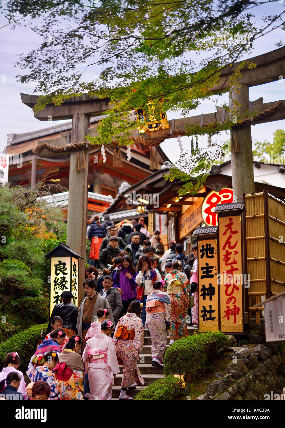 People entering through Torii gate to Jishu Jinja, matchmaking shrine, JishuJinja shrine at Kiyomizu-dera Buddhist temple in Higashiyama, Kyoto, Japan Stock Photo