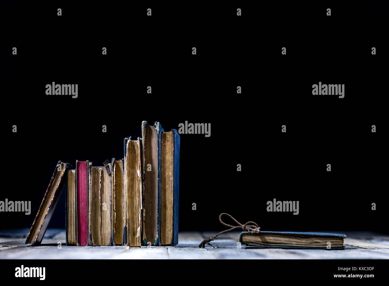 Old destroyed books on a wooden table. Reading room library with very ...