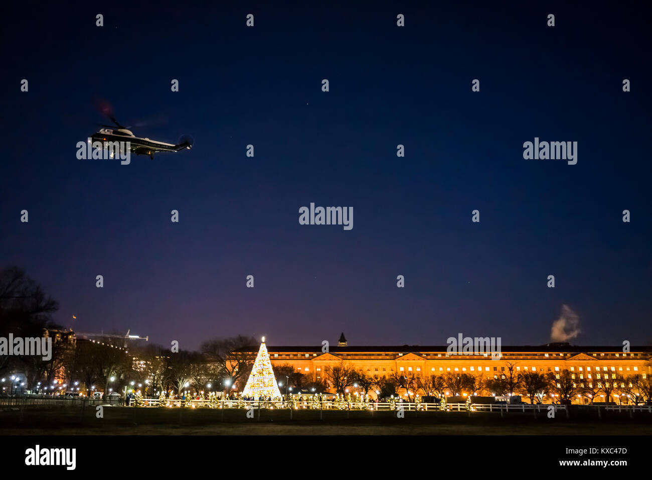 Washington DC, USA - December 28, 2017: President Donald J. Trump's Marine One helicopter flying landing by National Christmas tree memorial in sky at Stock Photo