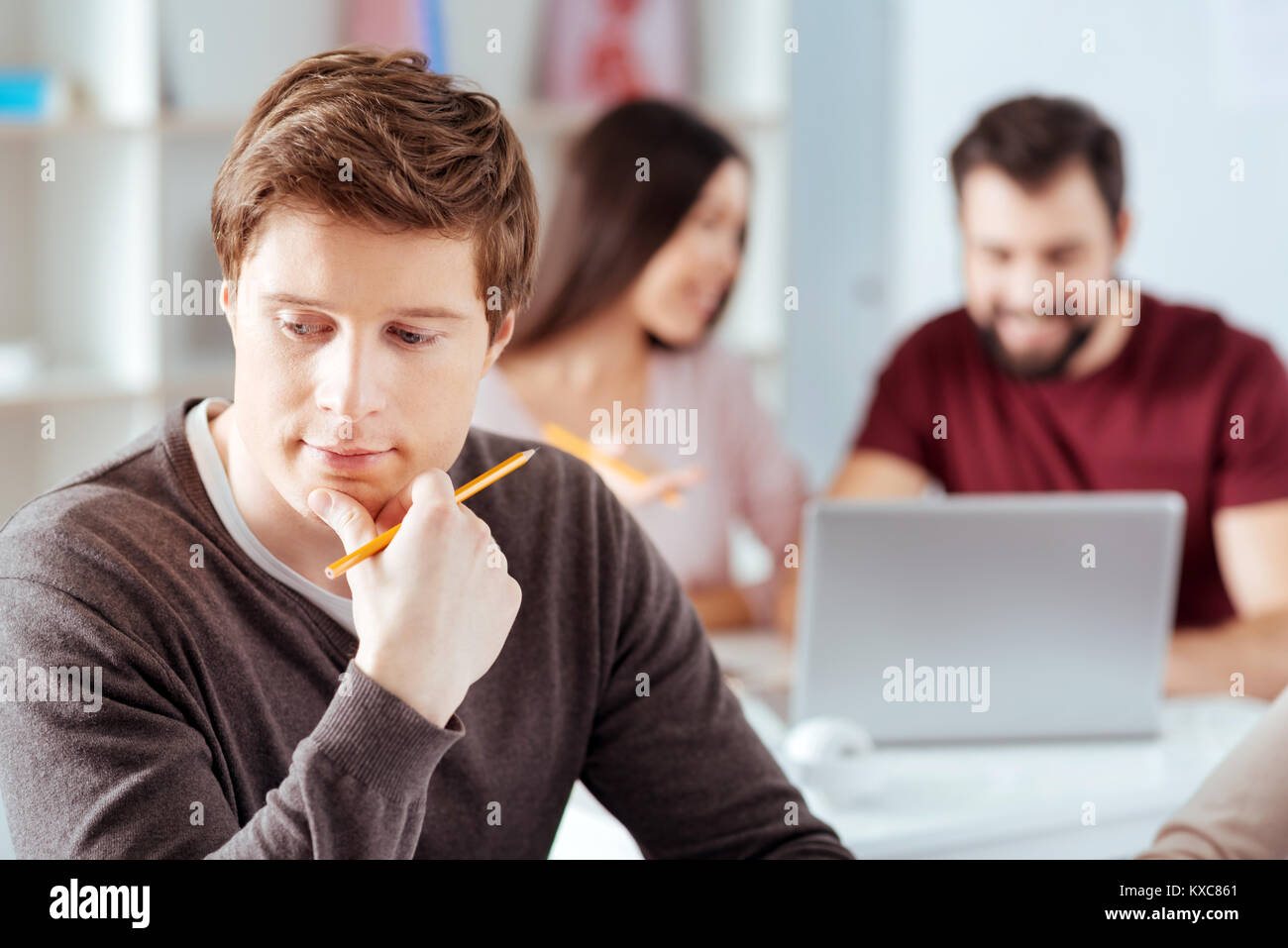 Pensive reflecting guy confronting problem Stock Photo