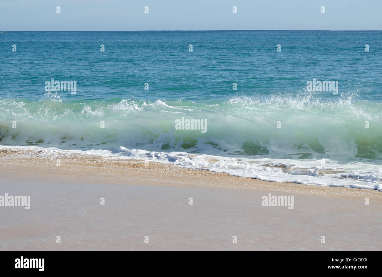 Beautiful waves on sandy beach hi-res stock photography and images - Alamy