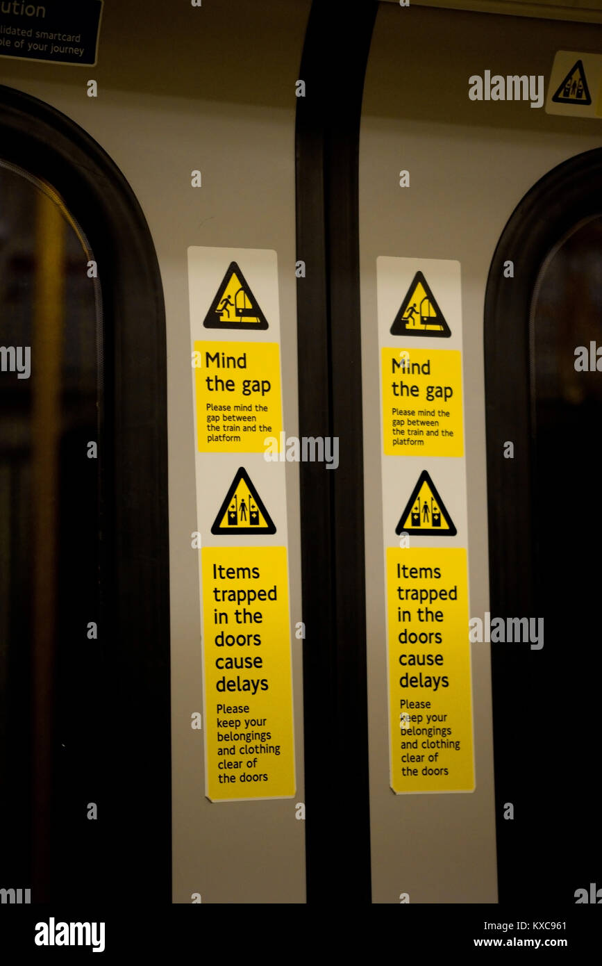 Mind the gap warning on London Underground train railway carriage doors. Notice signs Stock Photo