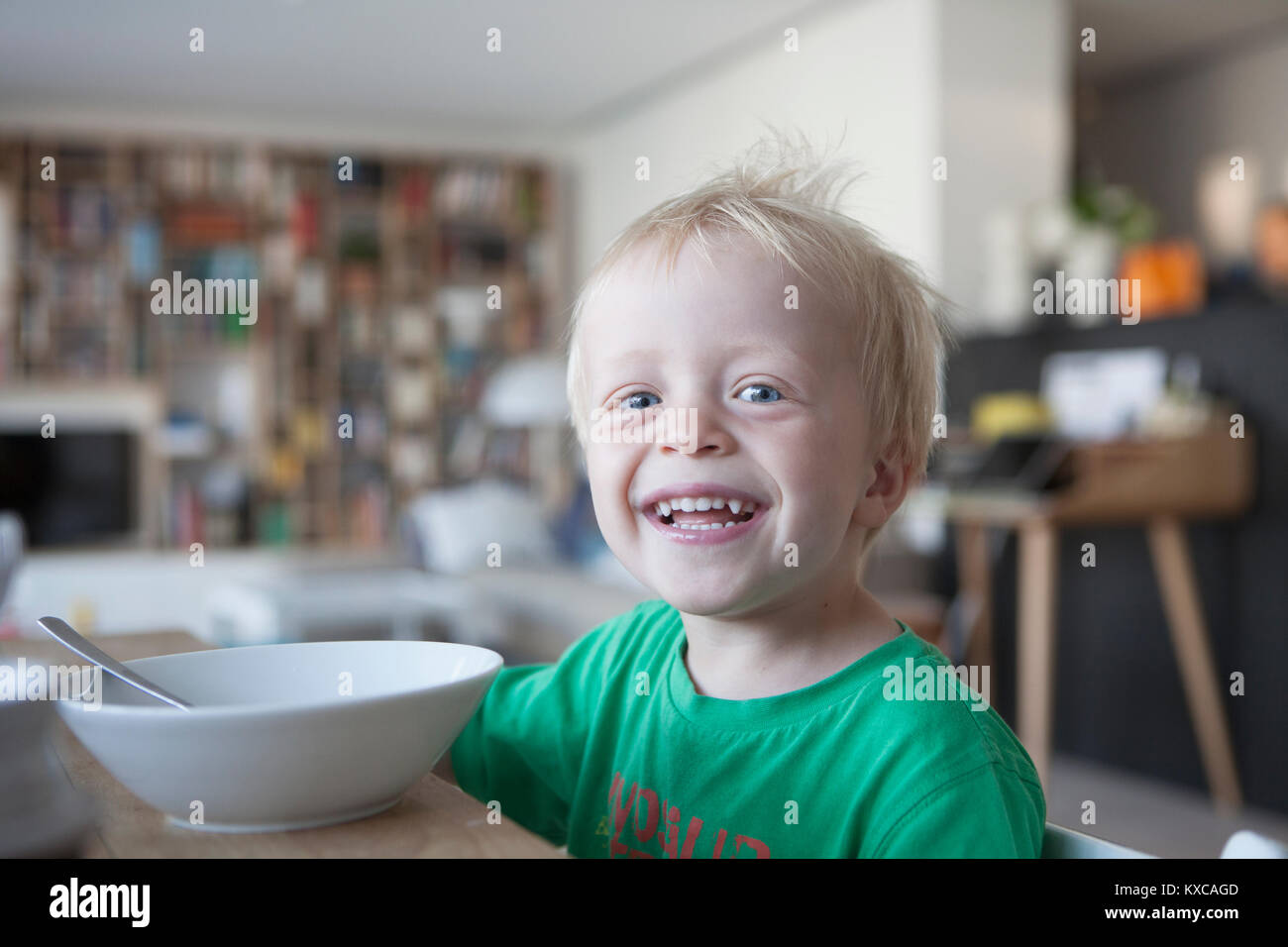 Portrait of happy little blond boy at home Stock Photo