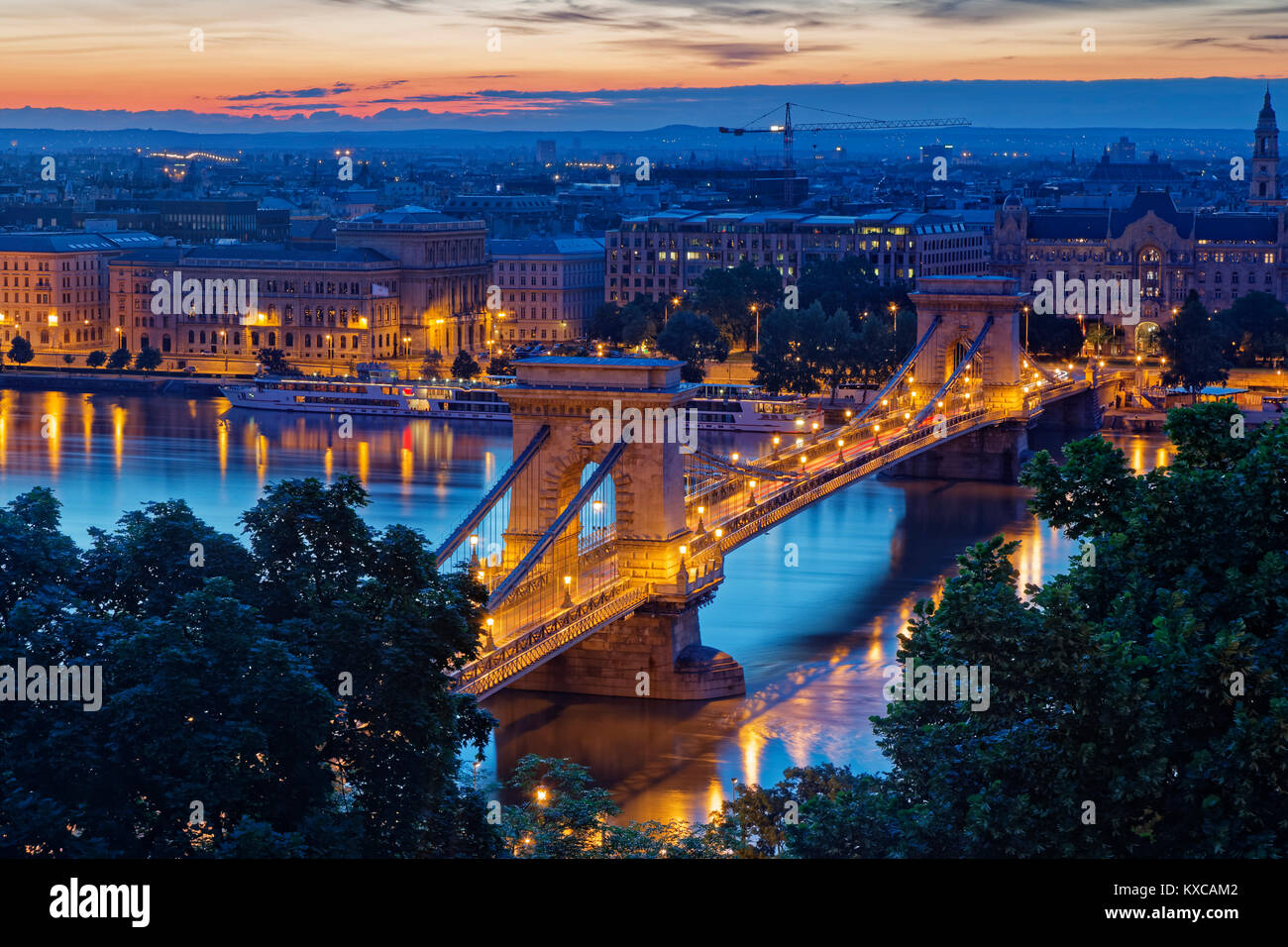 Hungary, Budapest, View to Pest with Chain bridge and Danube river in the evening Stock Photo