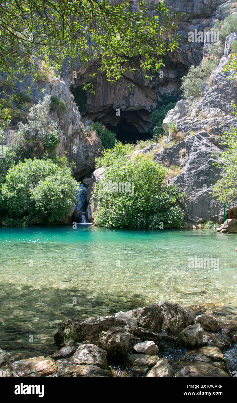 a beautiful crystal clear pool coming out of a cave near Ronda, Spain Stock Photo