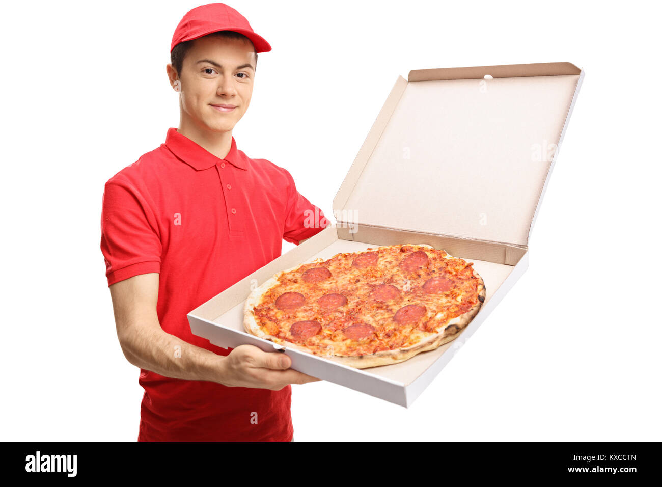 Teenage pizza delivery boy showing a pizza inside a box isolated on white background Stock Photo
