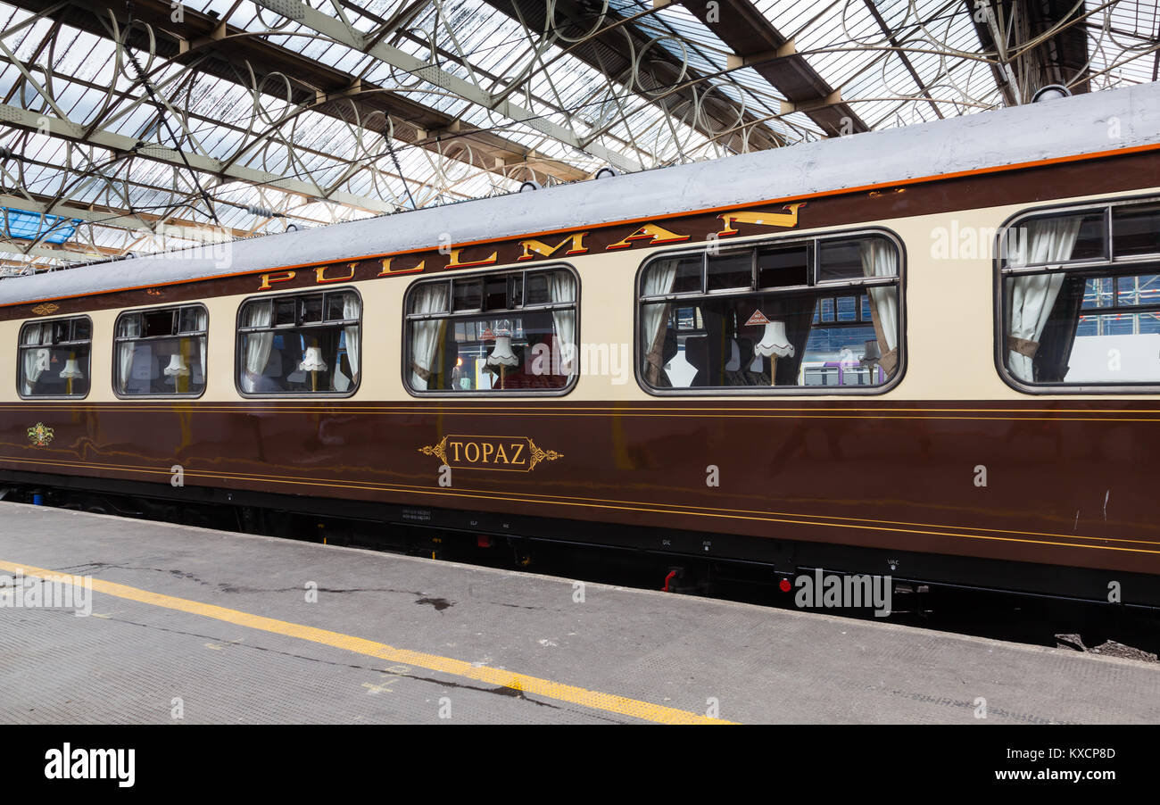 A preserved Pullman carriage is pictured in Carlisle Citadel station in Cumbria.  Pullman was a luxury railway service that operated in Great Britain. Stock Photo