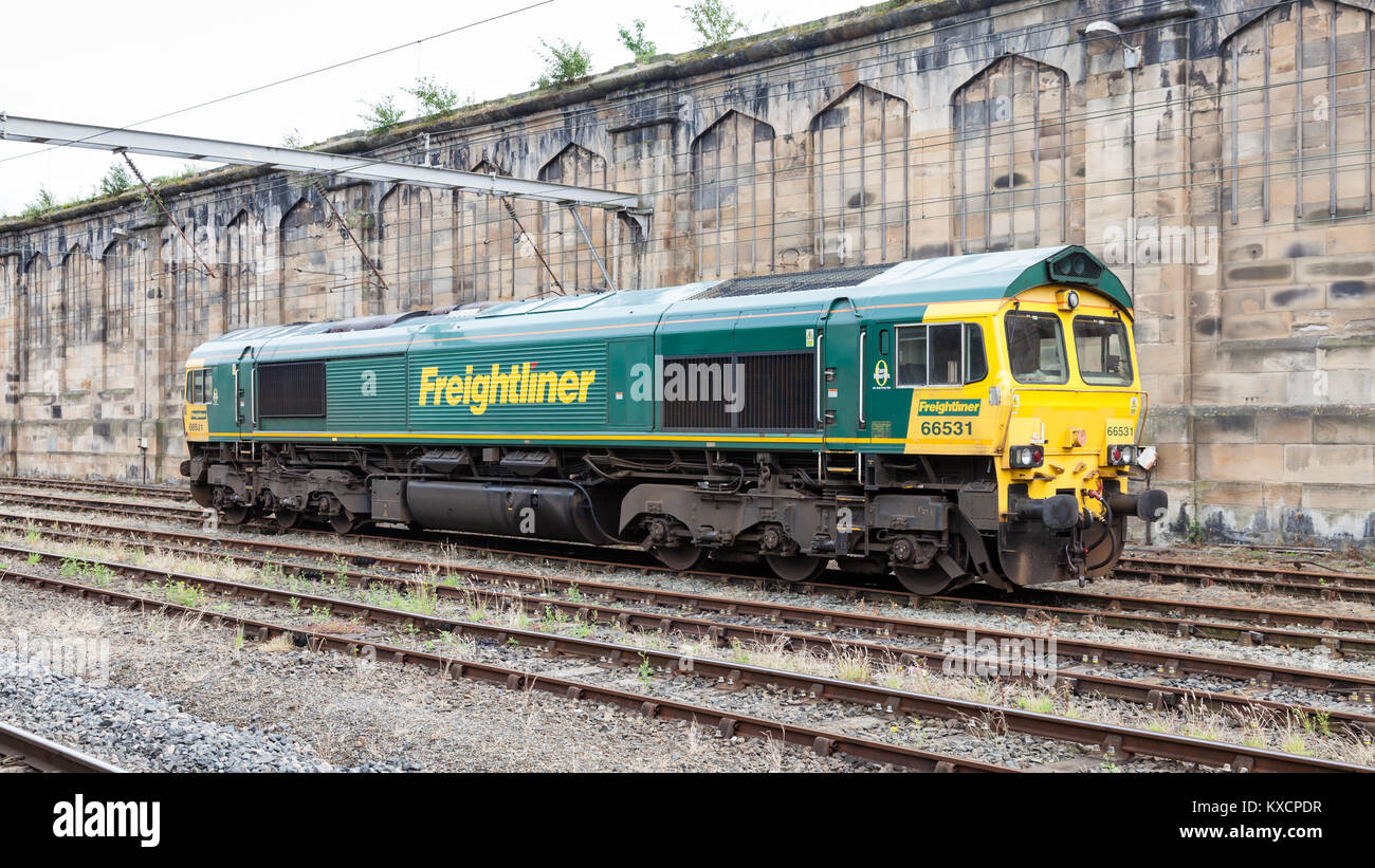 A class 66 Freightliner train pictured at Carlisle Citadel station in Cumbria.  Freightliner is a multinational rail freight and logistics company. Stock Photo
